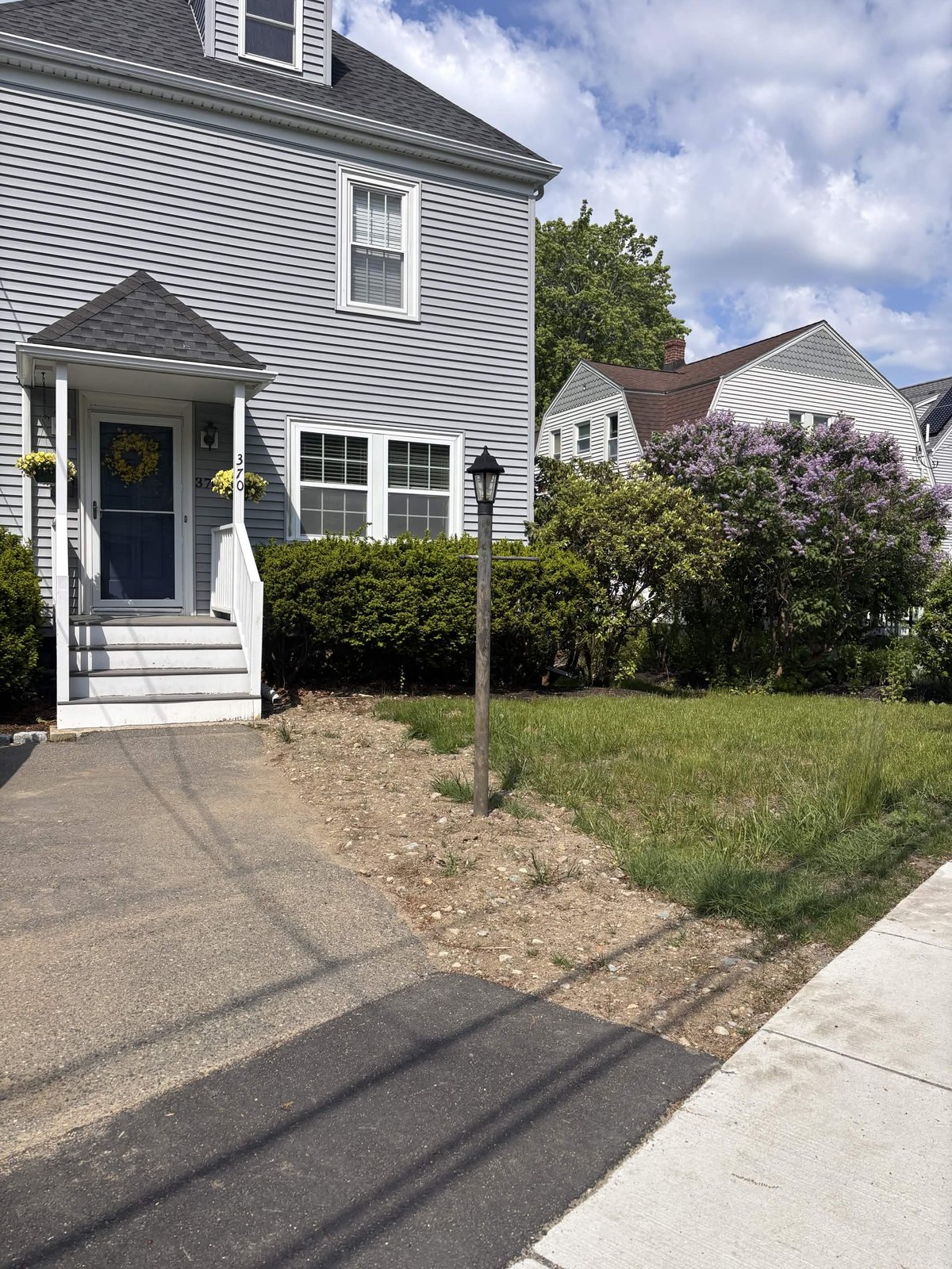 Bare, damaged lawn before seed and repair