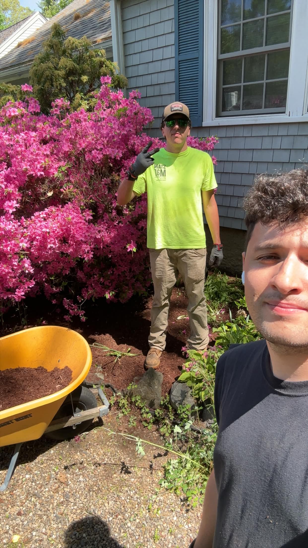 Zac, owner of Marron Brothers, on a mulch job with a crew member